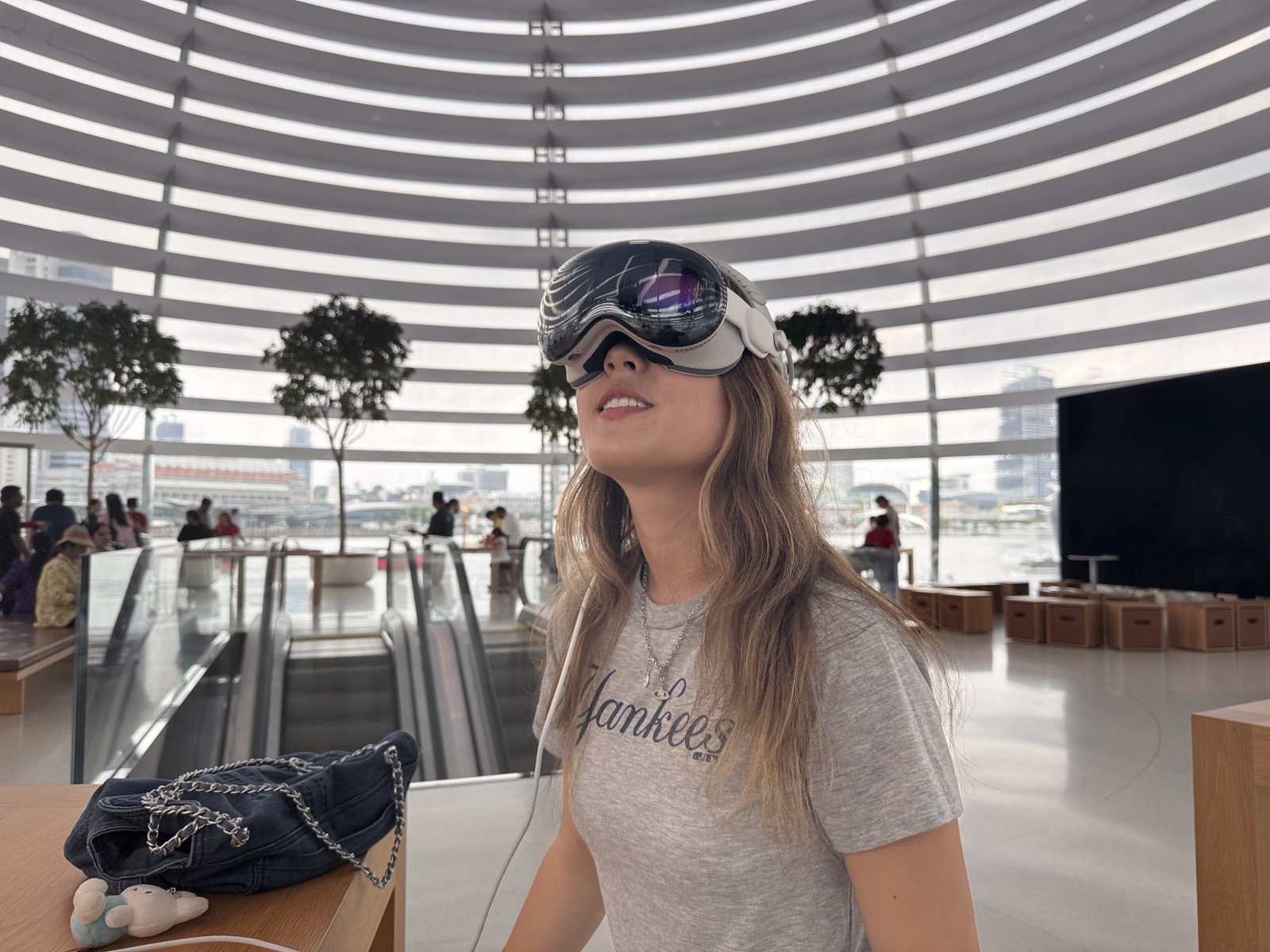 Ubin trying Apple Vision Pro for the first time at the Marina Bay Apple Store.
