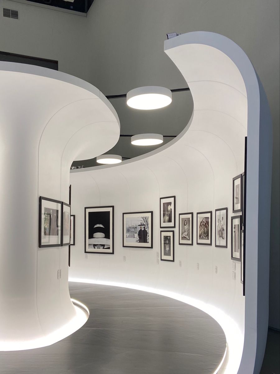 A curated museum gallery leading the visitor through a sequence of works.