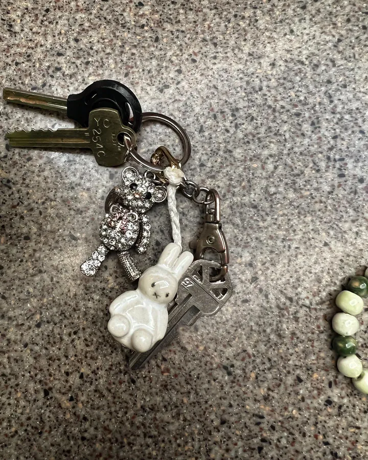 A keyring hung with handmade beaded charms including a small white Miffy rabbit.