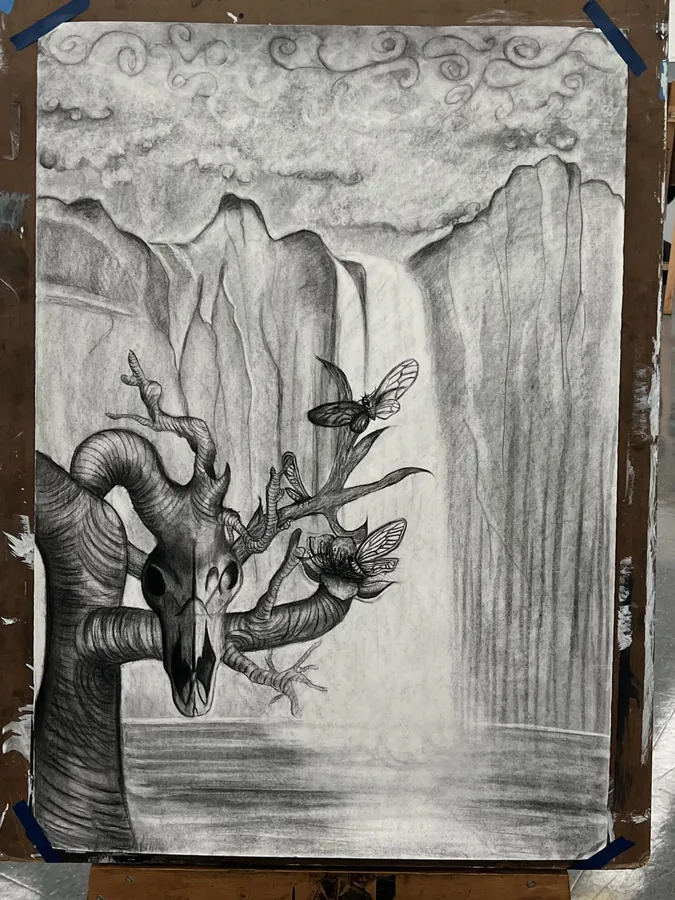 A large graphite drawing of a gnarled tree and birds in front of a waterfall, clipped to an easel.
