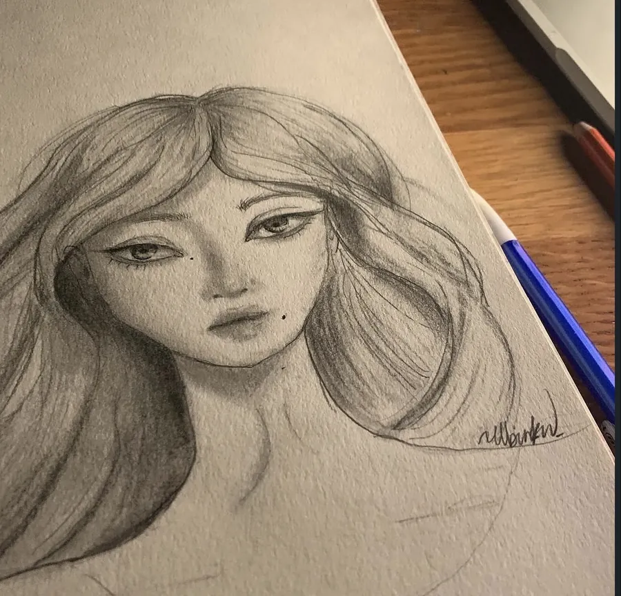 A charcoal and graphite portrait of a woman with long hair, drawn on textured paper.